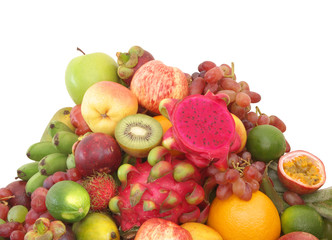 Heap of many tropical fruits isolated on white