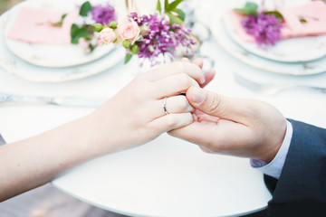 Hands of a loving couple. Wedding ring