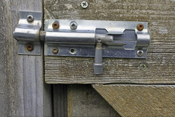Zinc barrel bolt on a wood garden gate