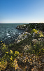 Panoramic landscape of rocky coastline during summer day