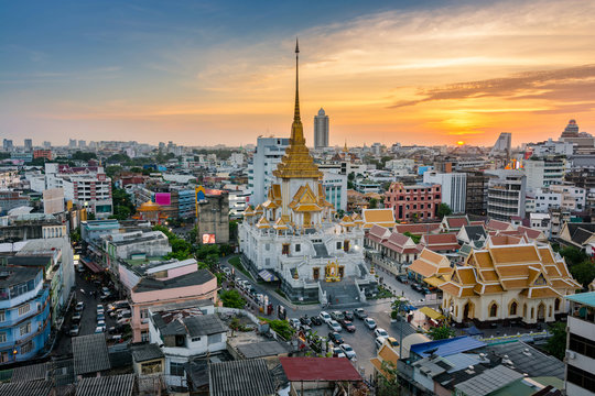 Aerial view cityscape twilight of Wat Trimit Witthayaram Worawihan and chinatown or yaowarat area, Temple of the Golden Buddha in Bangkok, Thailand.