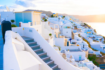 Oia town on Santorini island, Greece. Traditional and famous white and rose  houses at sunny day