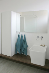 Modern bathroom with blue towels