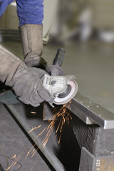 Grinding the iron with tools in the workshop