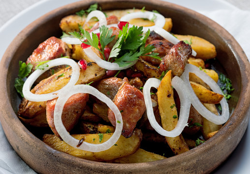 Fried meat in potatoes