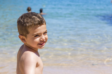 Little boy playing at beach