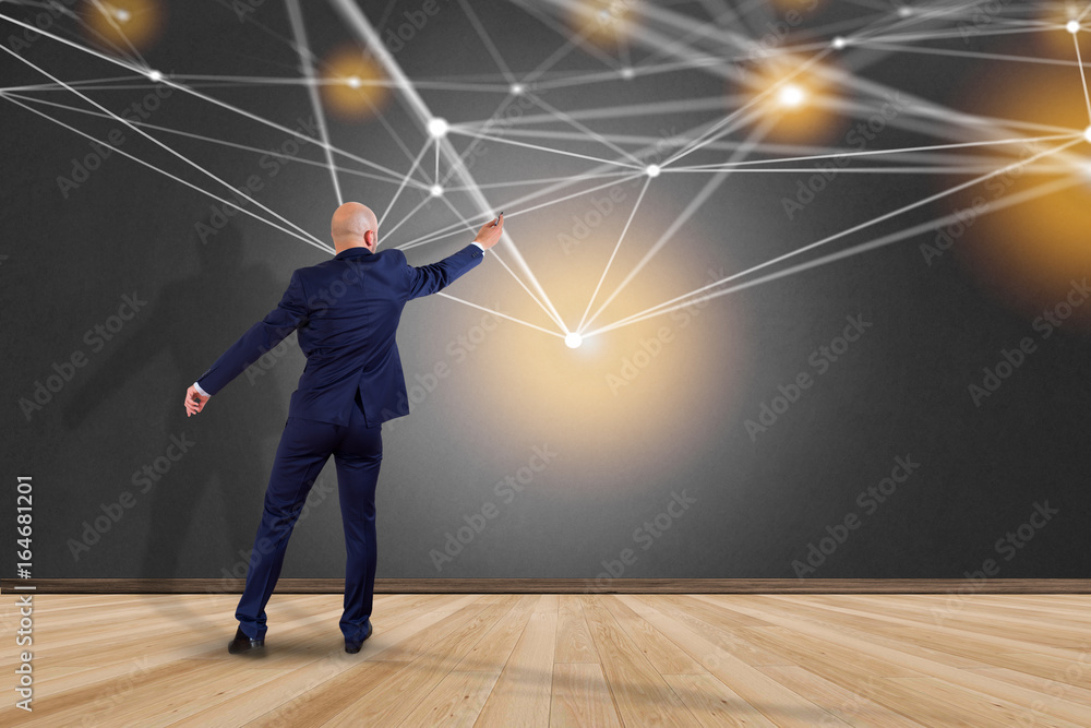 Poster businessman in front of a wall with web operating system screen and network connection displayed on 