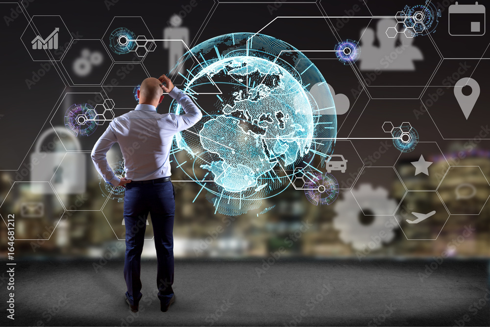 Poster businessman in front of a wall with an international business network connection displayed on a futu