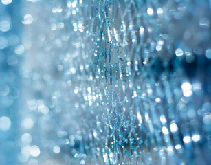 Broken glass close up with bokeh effect