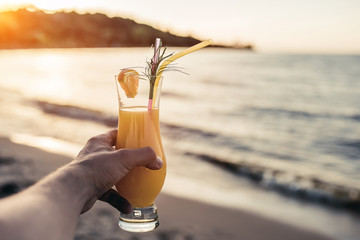 Taking cocktail in hand