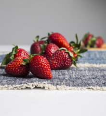 Juicy fresh strawberries in a white bowl