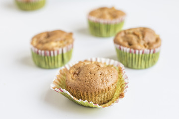 wholegrain muffins with apples on a dark wood background. tinting. selective focus