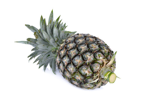 whole fresh pineapple on white background