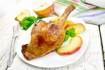 Duck leg with apple on board