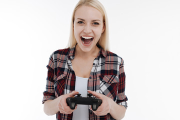 Funny girl playing with game console