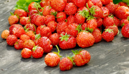 Ripe strawberries on wooden table