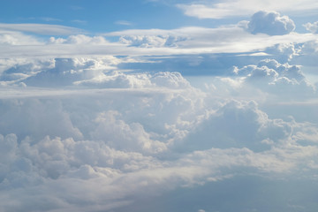 Aerial view from the plane of fluffy rain cloud in daytime - Cloudscape