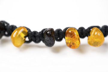 Bracelet made of amber beads and black cord