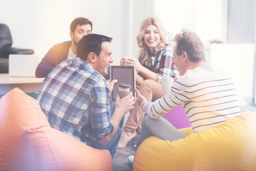 Cheerful colleagues having a break in the office