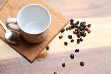 empty white coffee cup on wood background
