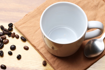 empty white coffee cup on wood background