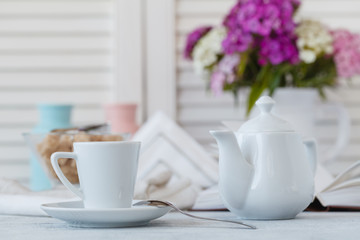 Home Interior with Coffee cup Books white flower on table wooden