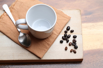 empty white coffee cup on wood background