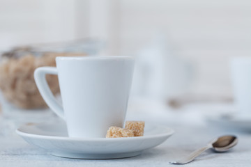 Photo coffee cup and sweets in a light key concept. still life in white