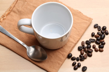 empty white coffee cup on wood background
