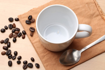 empty white coffee cup on wood background