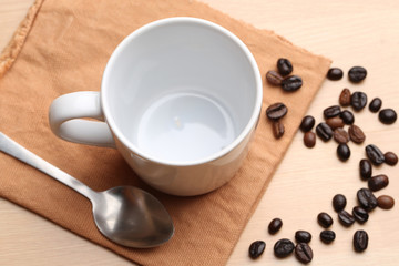 empty white coffee cup on wood background