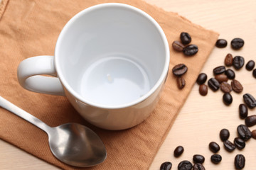 empty white coffee cup on wood background