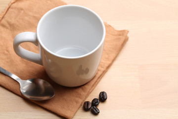 empty white coffee cup on wood background