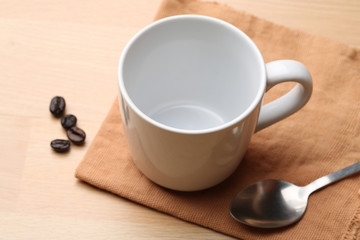 empty white coffee cup on wood background