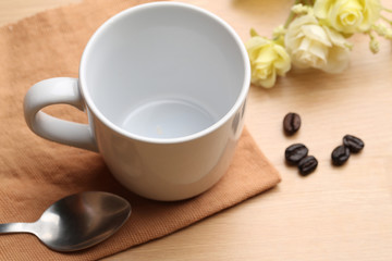 empty white coffee cup on wood background