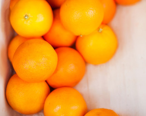 Fresh organic Orange fruits. Frame composition of fruits on market stall close up.