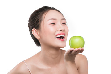 Smiling woman with healthy teeth holding green apple