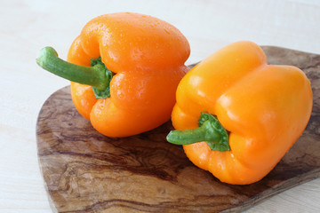 pepper on wood board