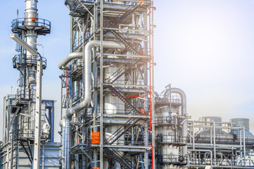 Fototapeta premium Industrial zone,The equipment of oil refining,Close-up of industrial pipelines of an oil-refinery plant,Detail of oil pipeline with valves in large oil refinery.