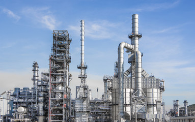 Fototapeta premium Industrial zone,The equipment of oil refining,Close-up of industrial pipelines of an oil-refinery plant,Detail of oil pipeline with valves in large oil refinery.