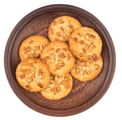 Peanut cookies in a brown plate. Isolated on white background.