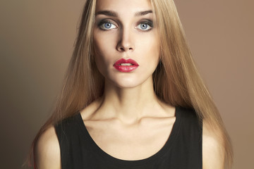 Young blond woman with red lips