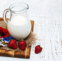 Jug with  milk and wildflowers