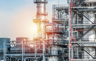Fototapeta premium Industrial zone,The equipment of oil refining,Close-up of industrial pipelines of an oil-refinery plant,Detail of oil pipeline with valves in large oil refinery.