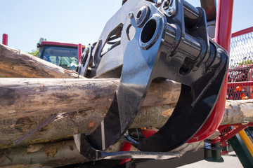 Wood loader machine on blue sky background