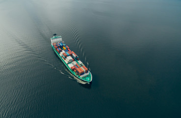 Aerial view of container vessel sailing in open sea