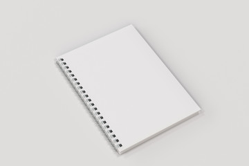 Closed notebook spiral bound on white background