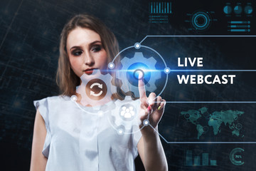 The concept of business, technology, the Internet and the network. A young entrepreneur working on a virtual screen of the future and sees the inscription: Live webcast