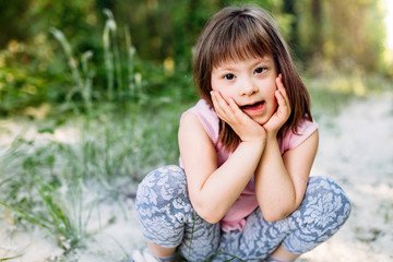 Portrait of young girl with down syndrome