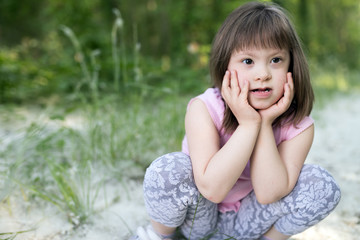 Portrait of young girl with down syndrome